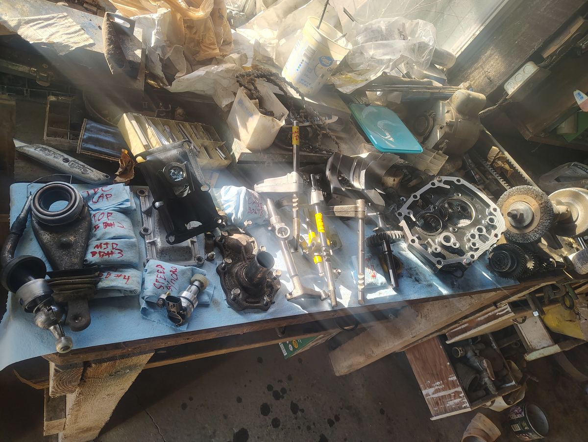 Labeled transmission parts laid out on the bench